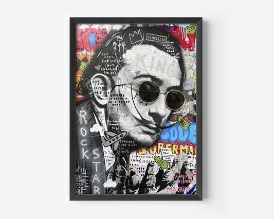 A framed, mixed-media, street-art style portrait of a man with dark hair, a mustache, and round sunglasses. The artwork is a collage of black and white portraiture overlaid with bold, colorful graffiti, text, and pop-culture imagery, including a crown icon, the word "KING," and phrases like "CANCELLED," "ROCKSTAR," and "SUPERMAN." The dominant colors are black, white, red, yellow, and blue.
