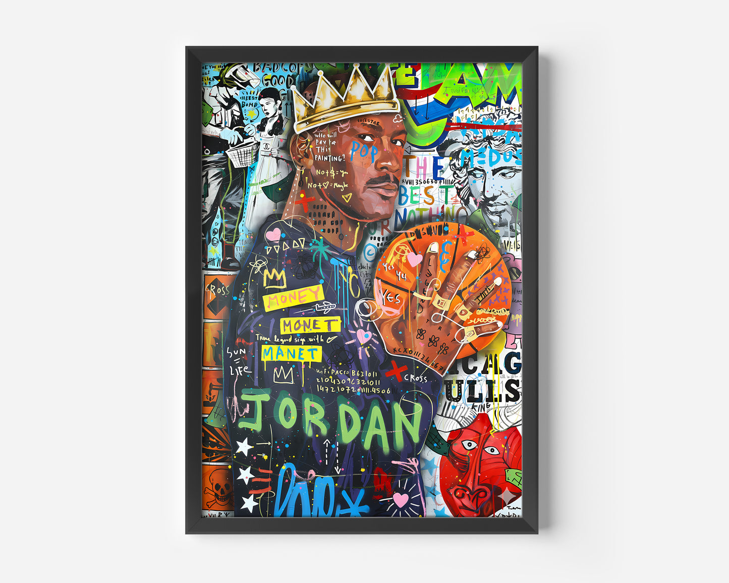 A framed, mixed-media, graffiti-style portrait of basketball legend Michael Jordan wearing a crown. The artwork features Jordan in a dark jersey, holding a basketball with rings on his fingers, overlaid with street art text, symbols, and bold colors. Prominent words and phrases include "JORDAN," "MONEY," "MANET," "GOAT," and the number 23. The background is a chaotic collage of green, blue, yellow, and white posters, giving the piece a vibrant, urban feel.